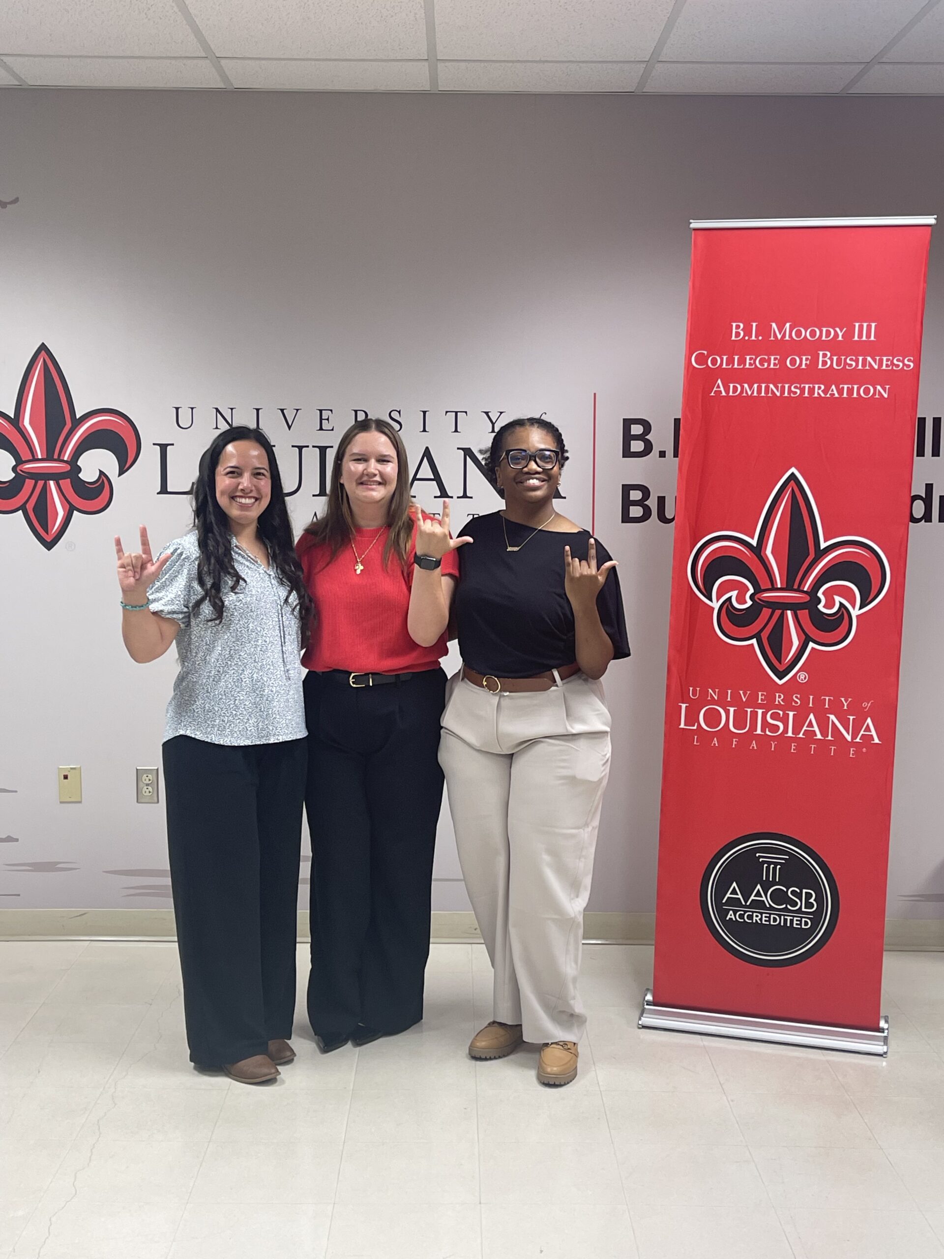 Students celebrating their Louisiana notary achievements